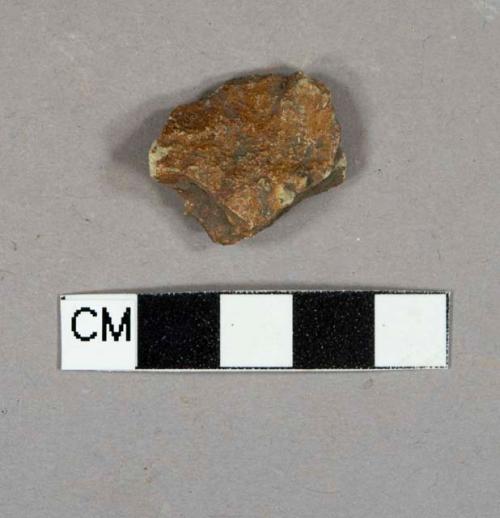 Reddish stone fragment