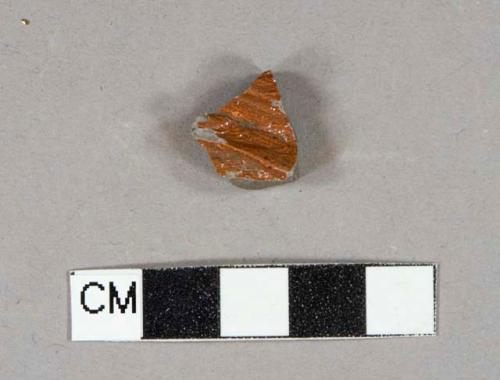 Red salt-glazed stoneware vessel body fragment, gray paste, molded lines