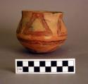 Small red on buff pottery jar-bowl; design of circles and triangles