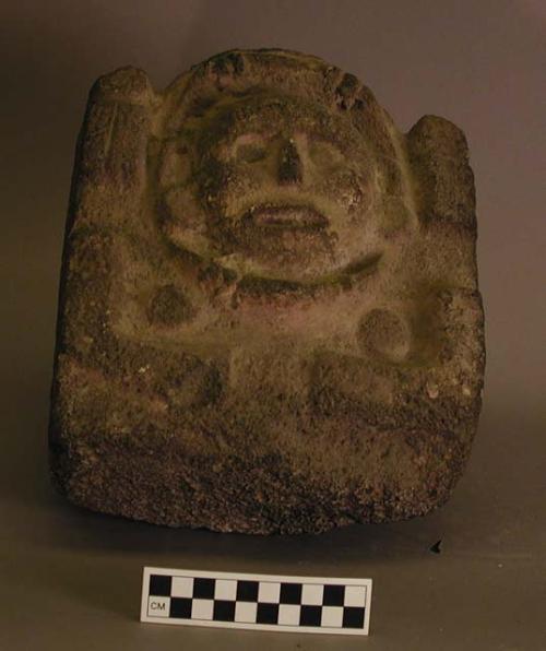 Carved stone head figure