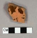 Red slip glazed redware vessel body fragment, undecorated