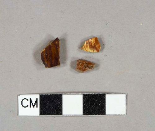 Brown lead-glazed earthenware vessel body fragments, reddish paste, likely rockingham ware