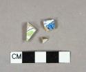 Whiteware vessel body fragments, 1 blue transferprint decoration, 1 polychome green and black decoration