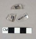 Colorles glass vessel rim, bottle finish, and body fragments