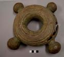Metal ring, nitien, cast brass with clay core; large; four knobs; crack in ring, casting flaw