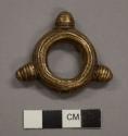 Small metal ring, cast brass; three rounded knobs