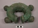 Metal ring, nitien, cast brass; four knobs, one deficient; large, some casting flaws