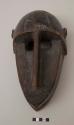 Boy's initiation mask, with domed forehead; oblong cut-out eyes