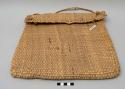 Basket - made of natural colored woven straw; flat and purse-like
