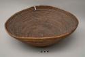 Large bowl-shaped basket-coiled weave, dark brown fibre (mbombo)