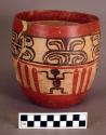 Ceramic jar, black and red on buff, figurine design, mended, sherds missing