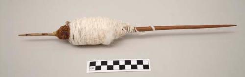 Spindle with white cotton and whorls