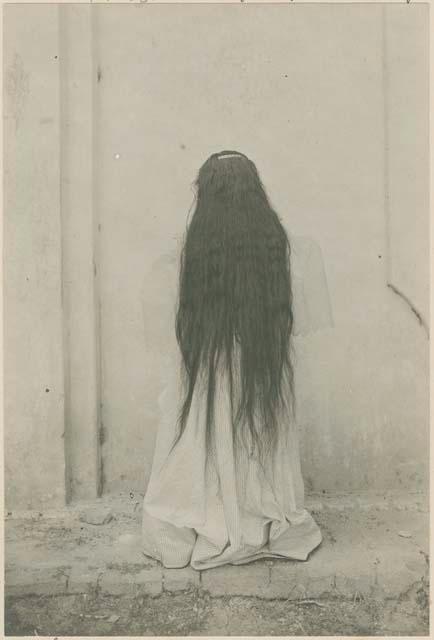 Ilocano woman showing length of hair