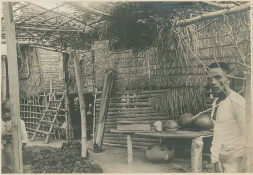 Ilocano man in room where clay pots are made