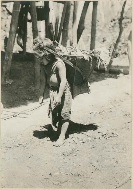 Young Ilongot with a carrying basket