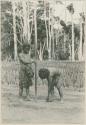 Two Ilongot men planting rice