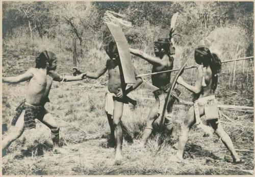 Ilongot men demonstrating an attack method