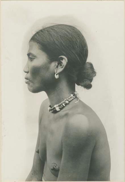 Profile of Kalinga woman wearing traditional Igorot earrings