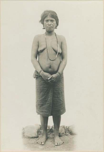 Middle-aged Kalinga woman wearing traditional Bontoc Igorrot earrings