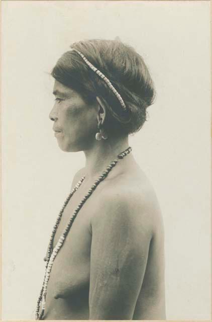 Middle-aged Kalinga woman wearing traditional Bontoc Igorrot earrings