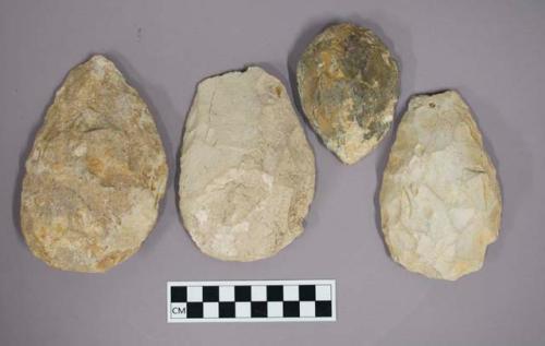 Large limestone flake tools retouched on upper face to hand axes, scrapers, clea