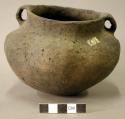 Ceramic vessel, two handles, short necked, punctate design around handle, bulbed