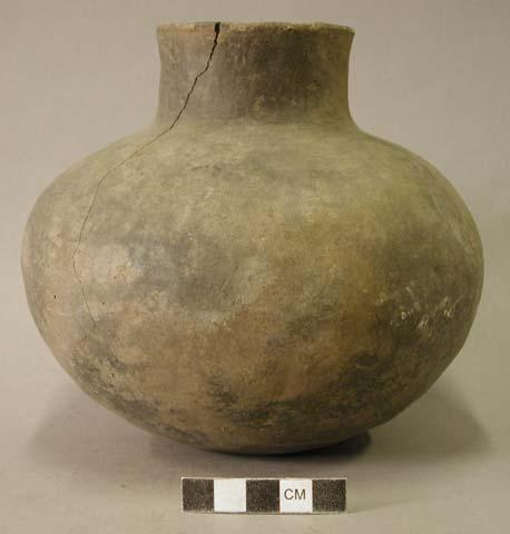 Ceramic vessel, short neck, cracked.