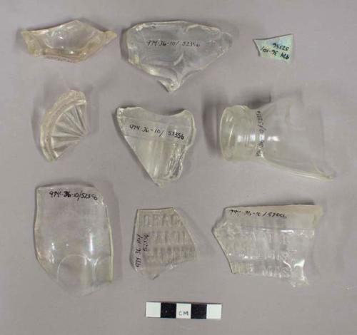 Pieces of glass bottle sherds; 2 small intact medicinal bottles; Screw-top bottl