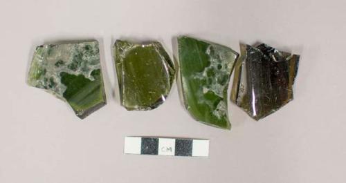 Sherds of at least 3 bottles; Probably wine. no dating possible. dark green an