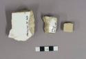 Ceramic tile fragments, with adhering plaster; Fragment of dressed limestone; Po