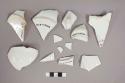 Pieces of ironstone cup and saucer fragments; Perhaps 19th century American.