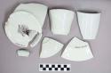 Miscellaneous assortment of ironstone cup, saucer, and chamberpot? fragments; Fr