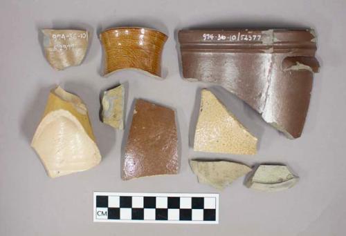 Stoneware jug and cider (?) bottle sherds; Half plain glazed bottle intact. pla