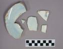 Fragments of bowl or wash basin; Light blue to white glaze