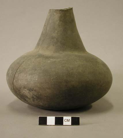 Ceramic vessel, long neck, neck partially broken off, vertical crack along body