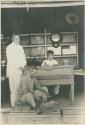 Three men in silversmith shop