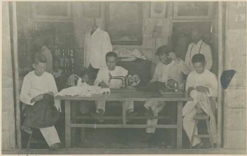 Men working in tailor shop