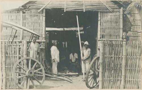 Men at a carriage shop