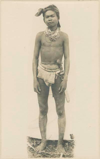 Mangyan man wearing traditional jewelry and clothing