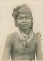 Mangyan man wearing traditional jewelry and hair style