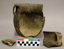 Ceramic, earthenware partial vessel with one handle, flared rim, cord-impressed body, shell-tempered, two body sherds, two rim sherds, includes handle; mended