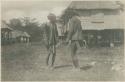 Two Mangyan men dancing