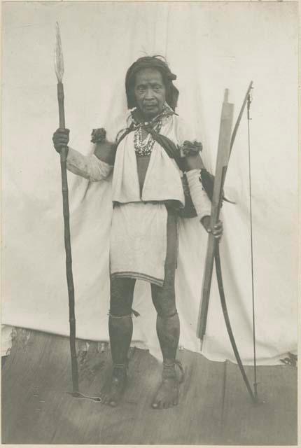 Elderly Mangyan man with hunting lance and quiver filled with poison