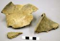 Ceramic, earthenware body and rim sherds, molded, with fragments of plaster used to reconstruct vessel