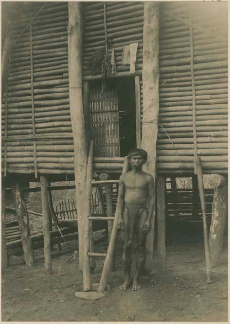 Bloodstained pieces of bark cloth on door of house