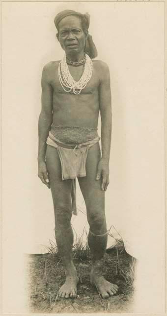 Mangyan man wearing traditional jewelry and clothing
