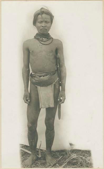 Mangyan man wearing traditional jewelry and clothing