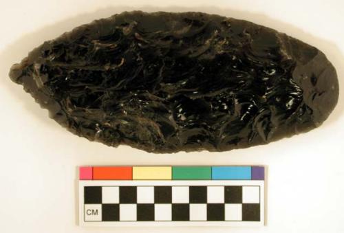 Chipped implement, chipped from black obsidian