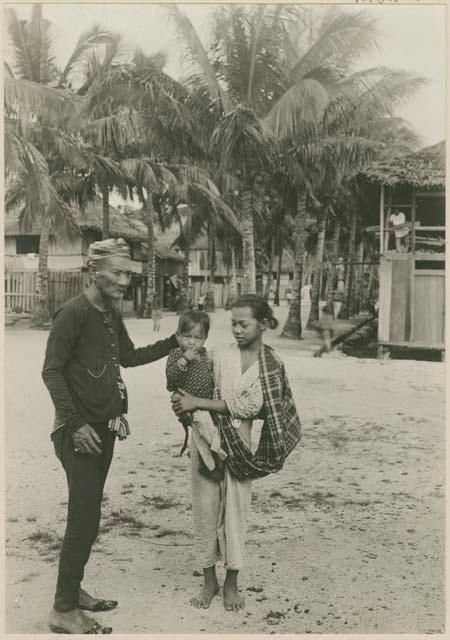 Maharajah of Jolo standing with a young girl and child