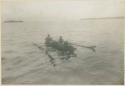 Men paddling in boat